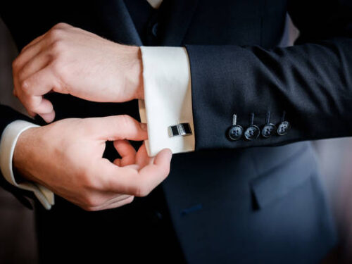 Beautiful stylish groom's cufflinks on the shirt